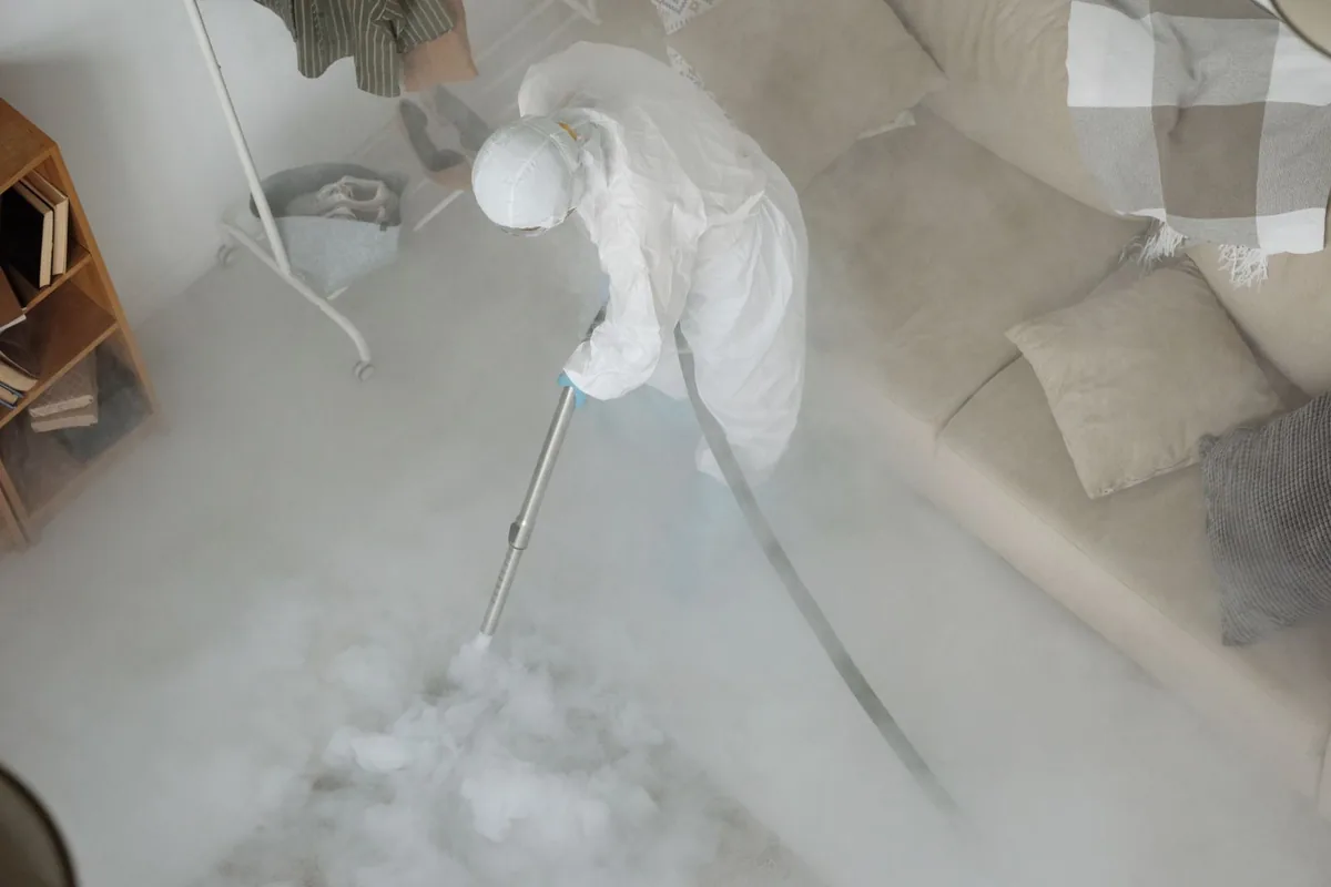 Biohazard cleanup technician in protective equipment, Terrell, TX
